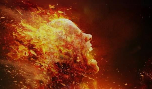 Face dissolving into fire