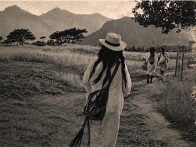 Woman walking along a country path