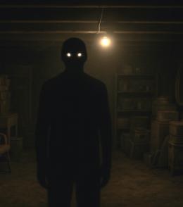 Shadowy figure with glowing eyes